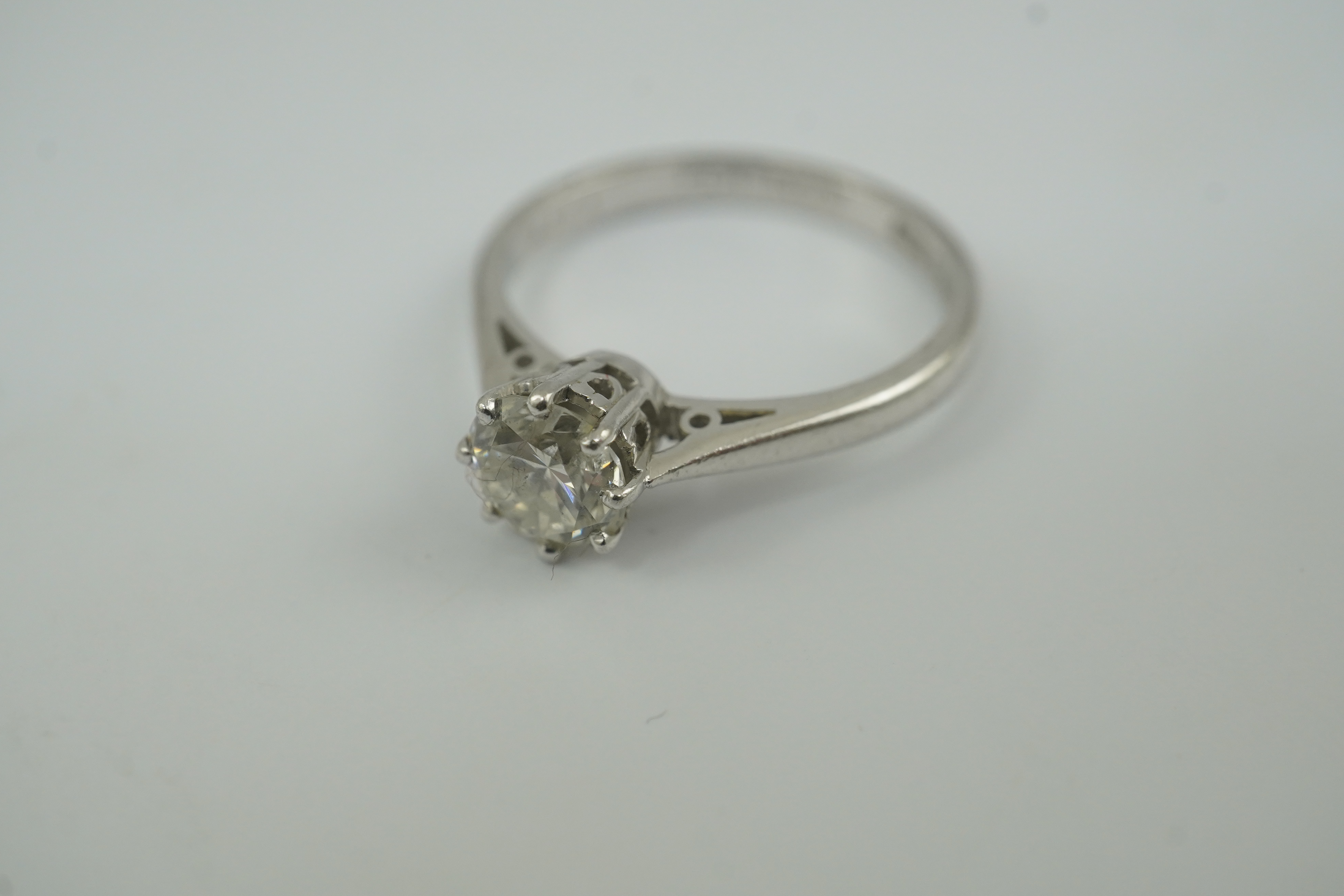 A modern platinum and solitaire diamond set ring